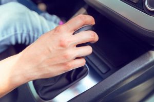clutch control tips, close up of hand shifting gears
