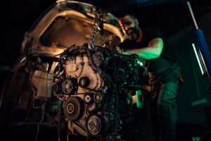 car engine problems, mechanic working on car engine