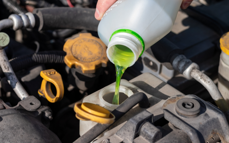 Adding coolant to a car cooling system reservoir
