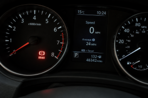 Brake warning light illuminated on a vehicle dashboard