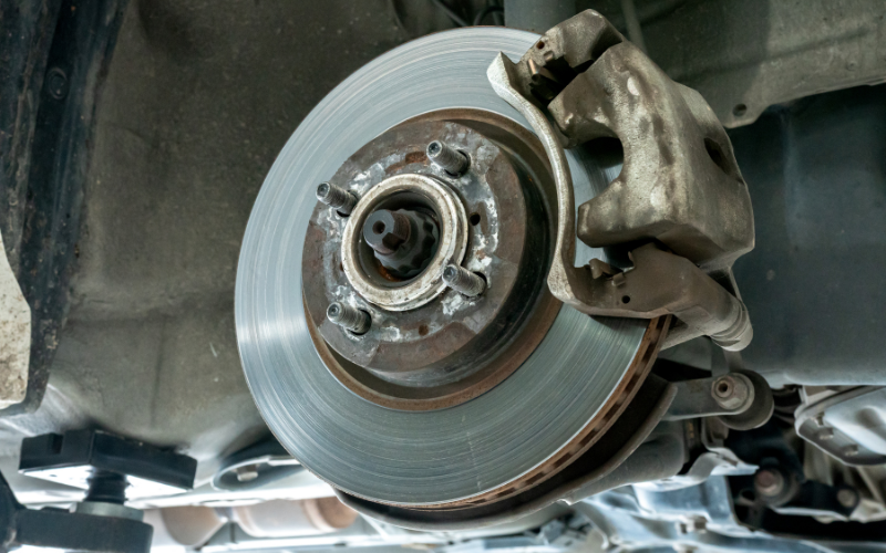 Brake disc and brake caliper inspected as part of an MOT test
