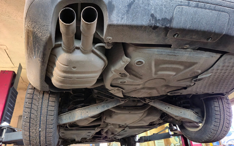 Underside of a car showing the exhaust system and its components