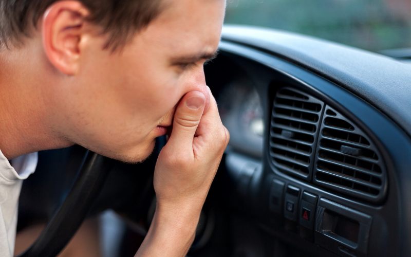 Driver noticing a burning smell inside his car