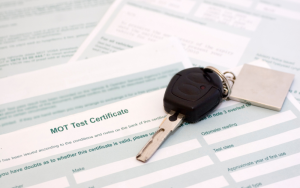 Car key resting on an MOT test certificate